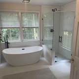 Luxury master bathroom with freestanding tub and glass shower